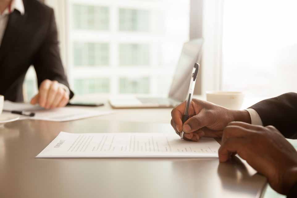 Signing business documents.