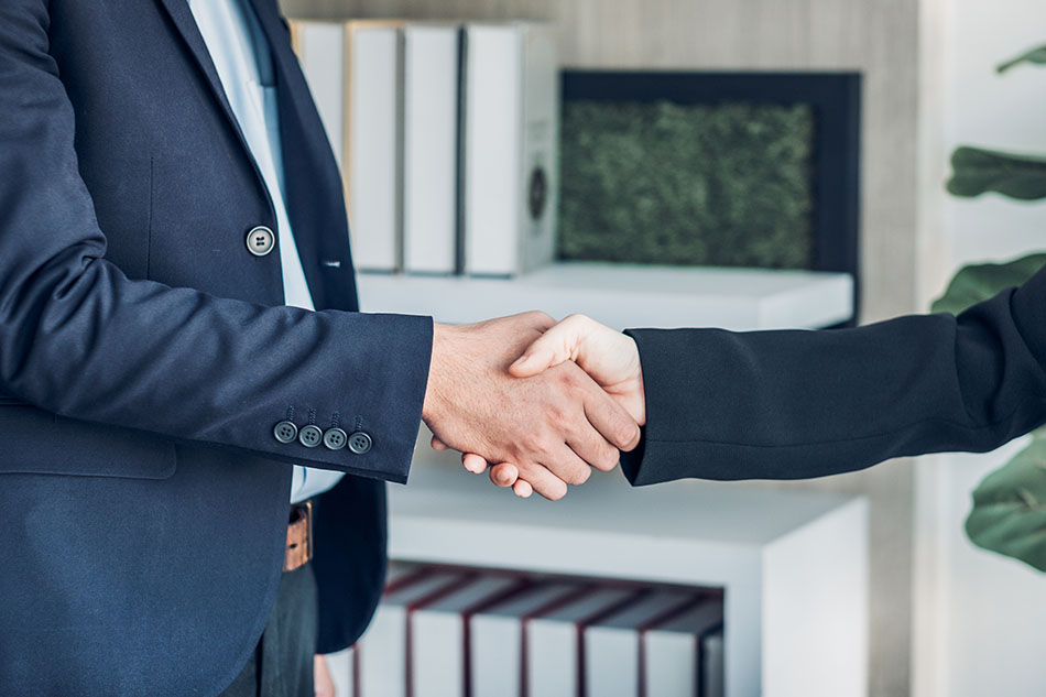 Handshake at business meeting.