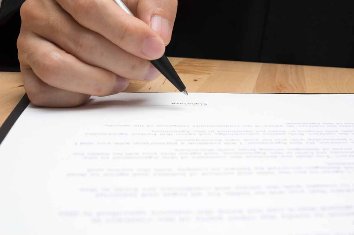 Signing business documents.