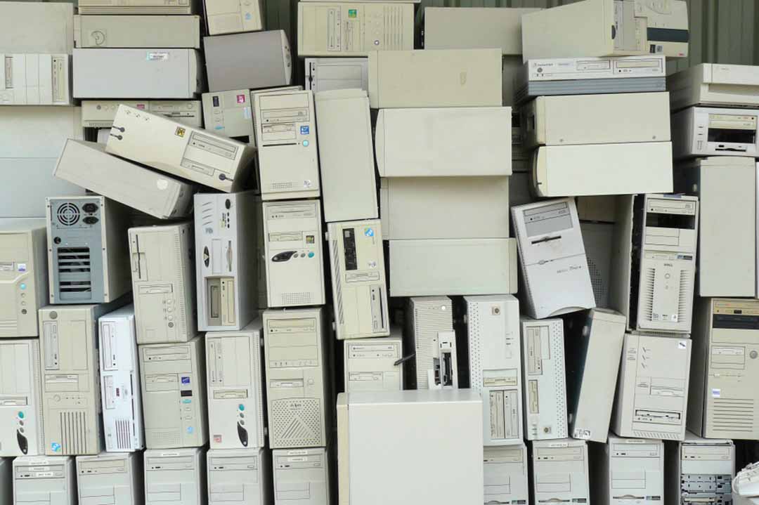 Computer towers collected and stacked for recycling.