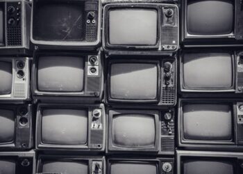 Old CRTs stacked for recycling.