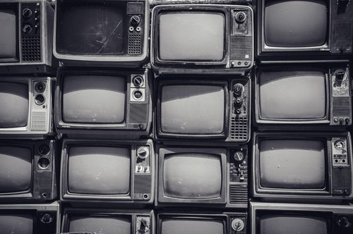 Old CRTs stacked for recycling.