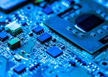 Close up of a circuitboard in blue light.