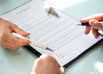 Signing a contract.