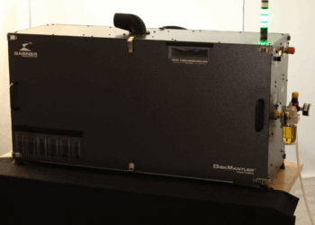 Device jostles hard drives apart for component recovery