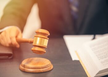 Plaintiff in processor lawsuit now facing criminal charges