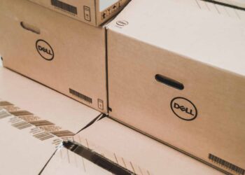 Dell computer boxes with desktop computers inside.