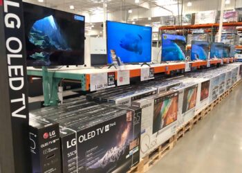 OLED televisions on store shelf.