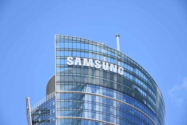 Samsung company sign on building with blue sky background.