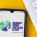 UN Climate Change Conference 2021 logo on mobile phone screen.