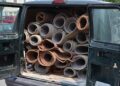 Van filled with rolled carpeting for recycling or disposal.