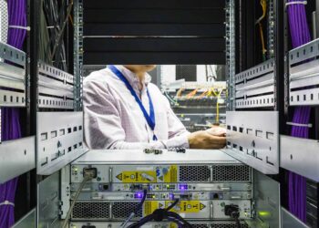 Servicing a hard disk at a data center.