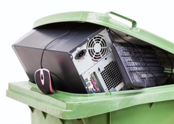 Electronics collected for recycling in a bin.