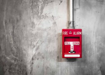 Fire alarm on a facility wall.
