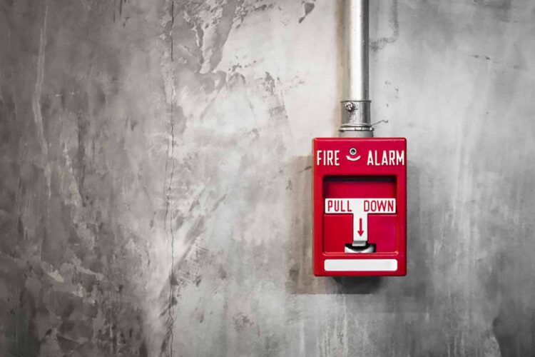 Fire alarm on a facility wall.