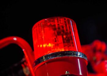 Closeup of firetruck light on truck with black background