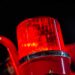 Closeup of firetruck light on truck with black background