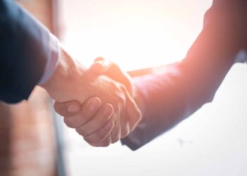 Business people shaking hands.