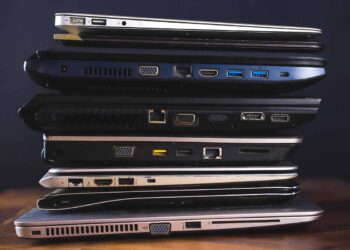 Laptops stacked for recycling.