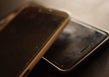 Used cellphones stacked for recycling.