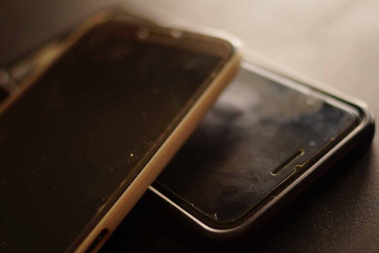 Used cellphones stacked for recycling.