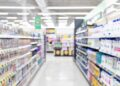 Retail aisle with paper and plastic packaging.