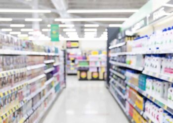Retail aisle with paper and plastic packaging.