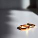 Wedding rings on a white table.