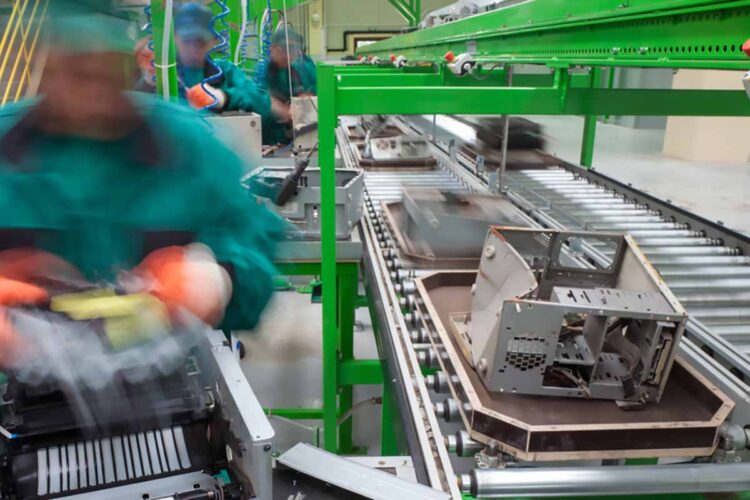 Workers at a electronics recycling facility.