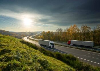 Trucks driving on a highway.