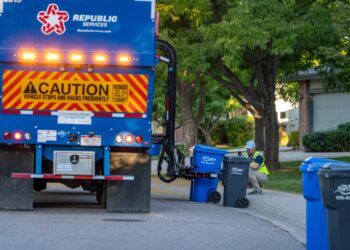 A Republic Services truck picks up a recycling cart in Fort Collins, Colorado.