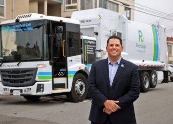 Recology CEO Sal Coniglio in front of one of the hauler's trucks