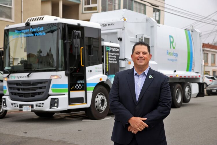 Recology CEO Sal Coniglio in front of one of the hauler's trucks